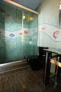 Custom porcelain tile, glass and custom fish bathroom 