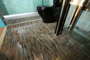 Custom porcelain tile, glass and custom fish bathroom 