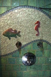 Custom porcelain tile, glass and custom fish bathroom 