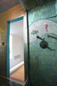 Custom porcelain tile, glass and custom fish bathroom 