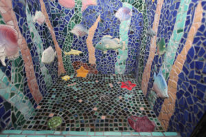 Bathroom shower mosaic with custom ceramic fish