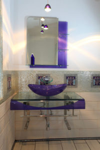 Glass and tile bathroom with custom deco tile